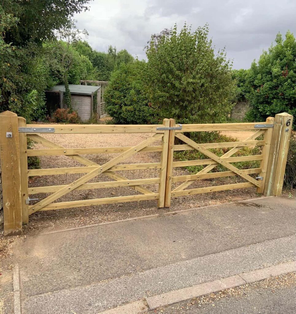 This is a photo of a wooden driveway gate installed by Fast Fix Fencing Histon